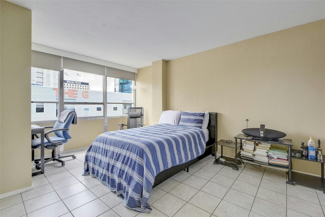 bedroom featuring light tile patterned floors