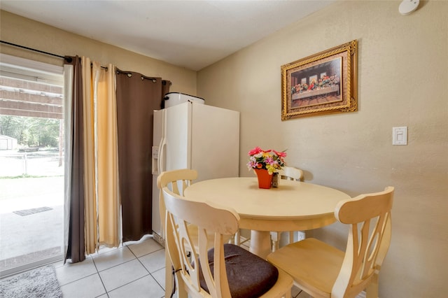 dining room with light tile patterned flooring