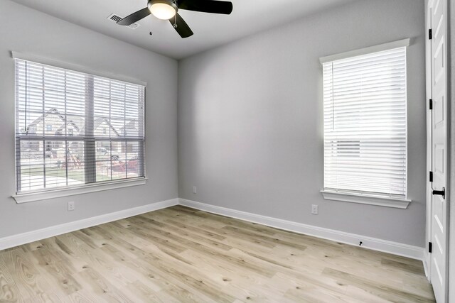 spare room with ceiling fan and light hardwood / wood-style floors