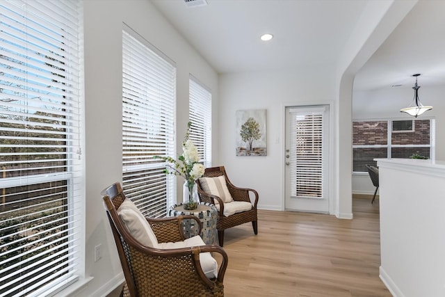 living area with light hardwood / wood-style floors