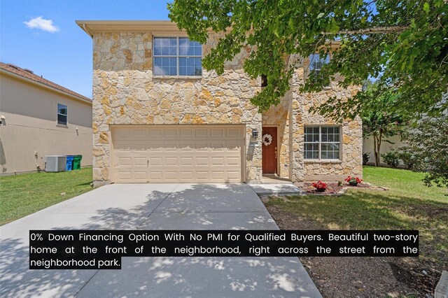 view of front facade featuring a front lawn, a garage, and central air condition unit