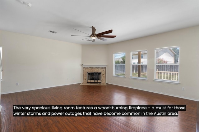 unfurnished living room with ceiling fan and dark hardwood / wood-style floors