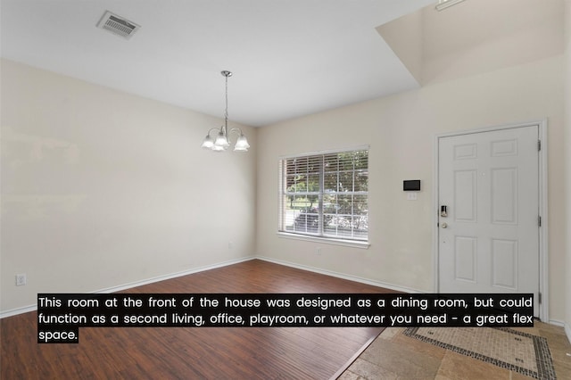 entryway featuring an inviting chandelier