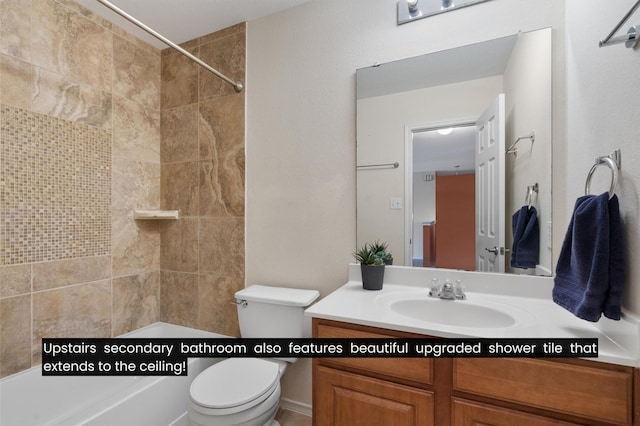 bathroom featuring toilet and vanity