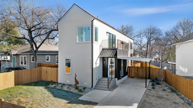 contemporary home with a front yard