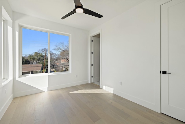 unfurnished room featuring ceiling fan and light wood-type flooring