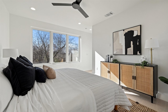 bedroom featuring ceiling fan and light hardwood / wood-style floors