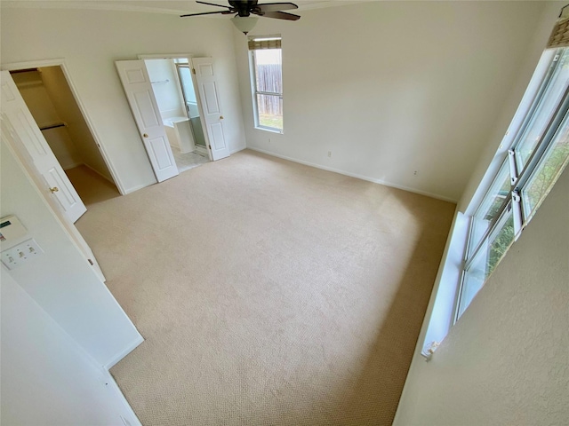 spare room featuring light carpet