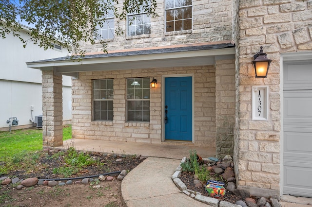 property entrance with central air condition unit and covered porch