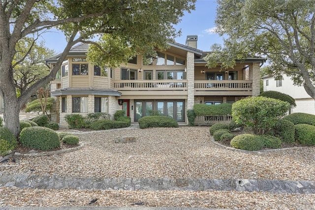 106 Firebird Cv, Lakeway, TX 78734 - view of front of property with a balcony and a chimney