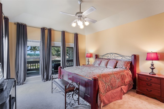 106 Firebird Cv, Lakeway, TX 78734 - bedroom with light colored carpet, access to exterior, lofted ceiling, and ceiling fan