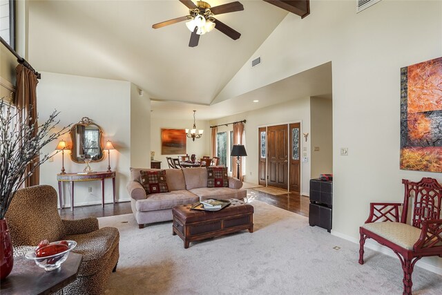 106 Firebird Cv, Lakeway, TX 78734 - living area with ceiling fan, high vaulted ceiling, a chandelier, beamed ceiling, and carpet