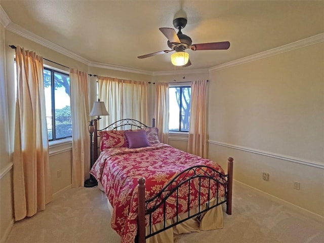 bedroom with crown molding, a ceiling fan, and light carpet