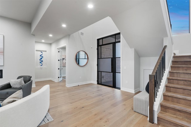 foyer with light wood-type flooring