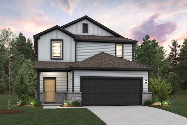 view of front of home featuring a garage and a lawn