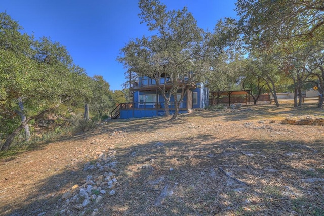 view of front of home with a wooden deck