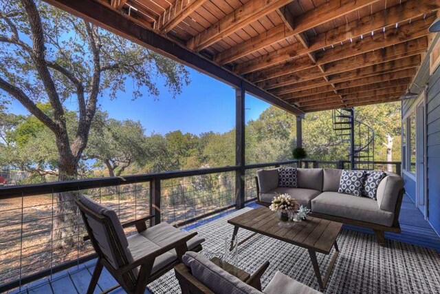 wooden terrace with outdoor lounge area