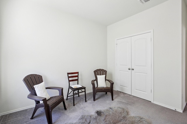 sitting room with carpet flooring