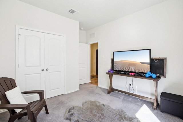 sitting room with light colored carpet