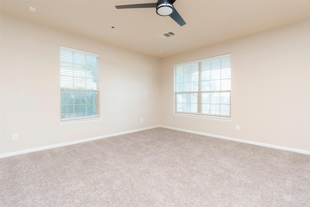 spare room with ceiling fan and carpet flooring