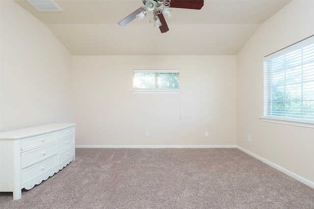 unfurnished room with ceiling fan, lofted ceiling, and light colored carpet