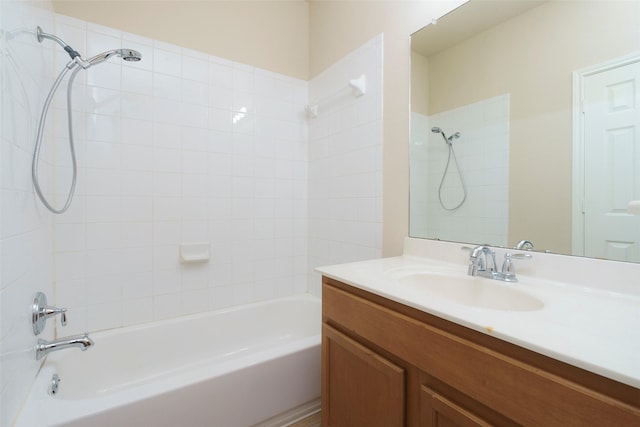 bathroom with washtub / shower combination and vanity