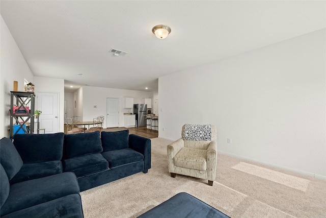 living room featuring light colored carpet