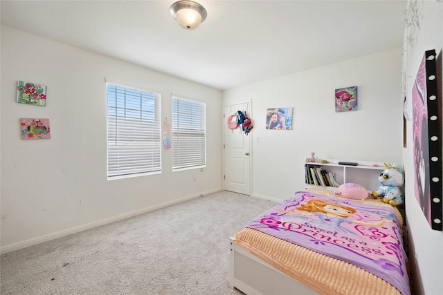 bedroom with light colored carpet