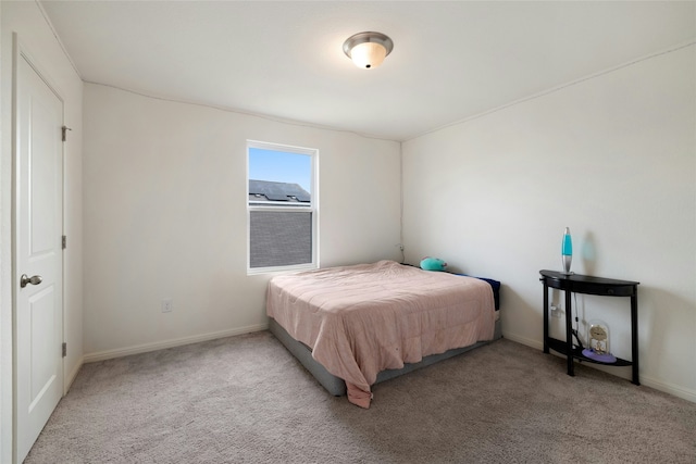 bedroom featuring light colored carpet