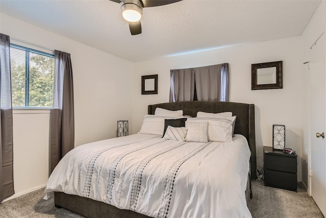 bedroom with ceiling fan and carpet floors