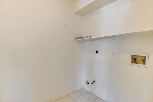 laundry area with hookup for a washing machine, light tile patterned flooring, gas dryer hookup, and hookup for an electric dryer