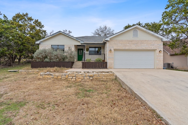 ranch-style house with a garage, a front yard, a porch, and central air condition unit