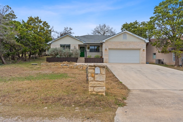 single story home with a front yard and a garage