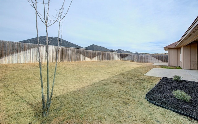 108 Elmer Ave, Burnet, TX 78611 - fenced backyard with a patio
