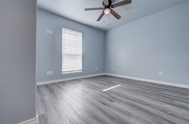 108 Elmer Ave, Burnet, TX 78611 - unfurnished room featuring wood finished floors and ceiling fan