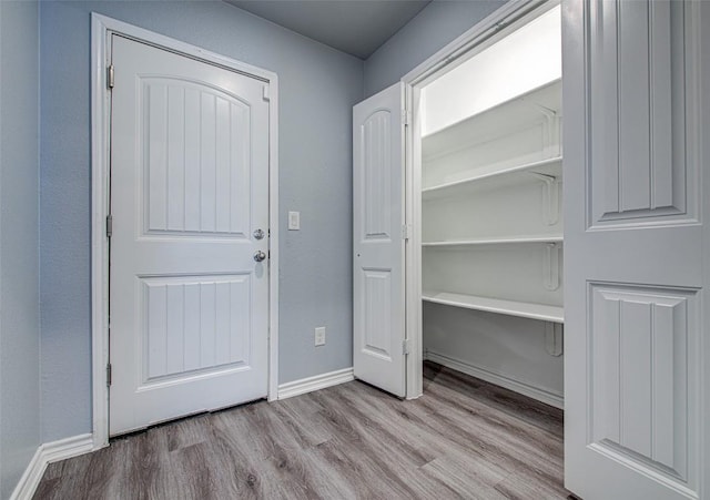 108 Elmer Ave, Burnet, TX 78611 - entrance foyer with wood finished floors and baseboards