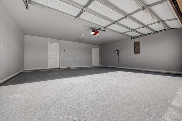 garage featuring a garage door opener and electric panel