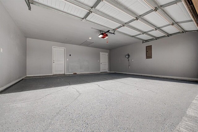 108 Elmer Ave, Burnet, TX 78611 - garage featuring a garage door opener and electric panel