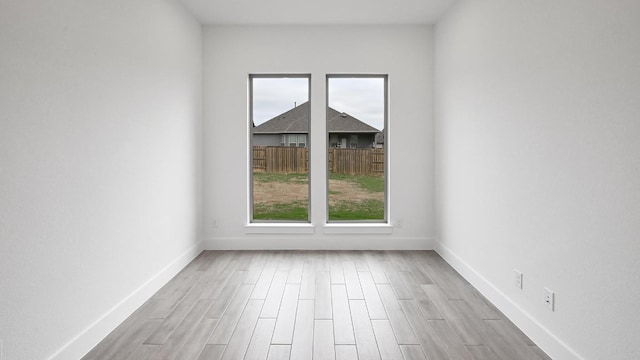 330 Allegheny Way, Kyle, TX 78640 - unfurnished room with baseboards and light wood finished floors