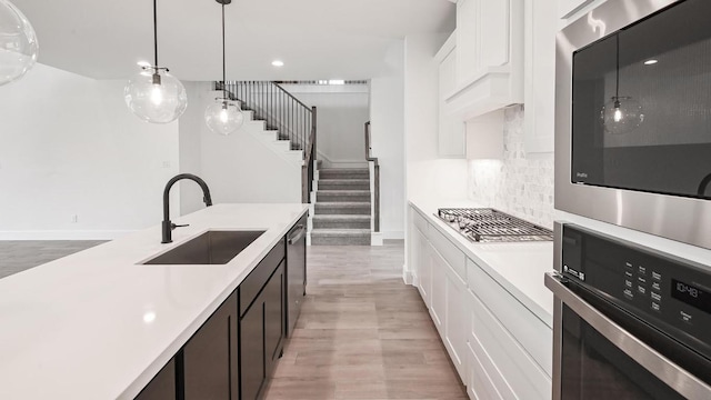 330 Allegheny Way, Kyle, TX 78640 - kitchen featuring light countertops, stainless steel appliances, white cabinets, and a sink