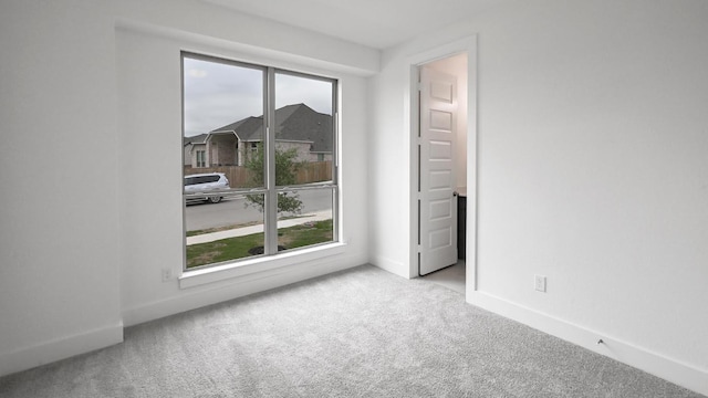 330 Allegheny Way, Kyle, TX 78640 - spare room featuring carpet, baseboards, and a healthy amount of sunlight