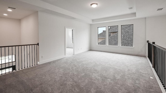 330 Allegheny Way, Kyle, TX 78640 - carpeted empty room featuring a tray ceiling, baseboards, and visible vents