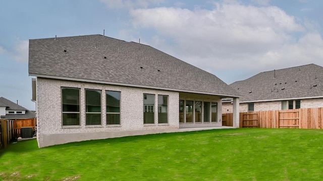 330 Allegheny Way, Kyle, TX 78640 - back of property featuring brick siding, a lawn, and a fenced backyard