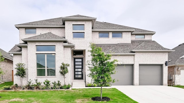 330 Allegheny Way, Kyle, TX 78640 - prairie-style home featuring a front lawn, a shingled roof, brick siding, and driveway