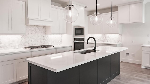 330 Allegheny Way, Kyle, TX 78640 - kitchen with a sink, white cabinetry, baseboards, and appliances with stainless steel finishes