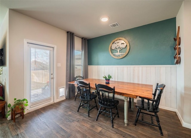 dining space with dark hardwood / wood-style flooring and breakfast area