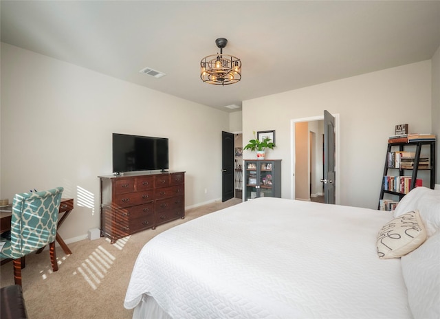 bedroom featuring light colored carpet