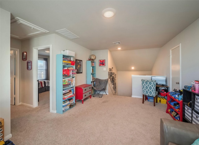 recreation room with vaulted ceiling and carpet flooring