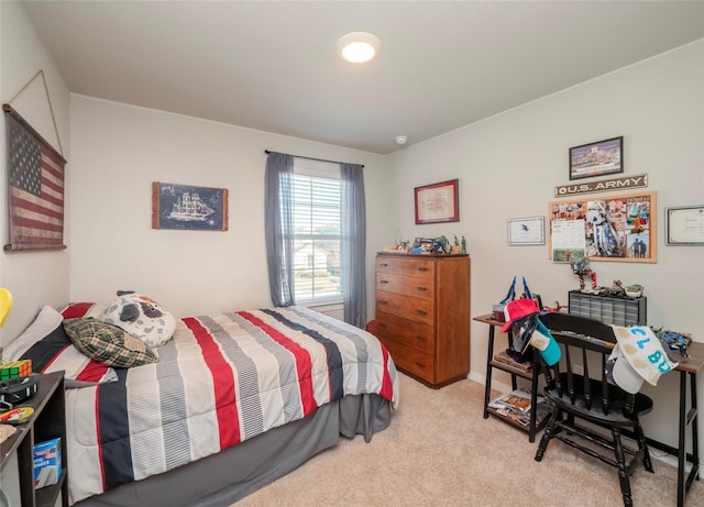 bedroom featuring light colored carpet