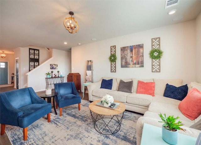 living room featuring an inviting chandelier